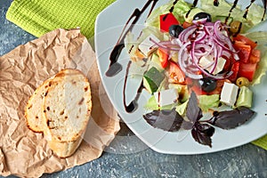 Greek salad with fresh vegetables, feta cheese and black olives