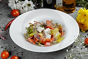 Greek salad with fresh vegetables, feta cheese and black olives