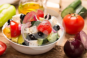 Greek salad with fresh vegetables, feta cheese and black olives. Horizontal