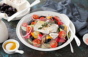 Greek salad with fresh vegetables, feta cheese and dried black olives