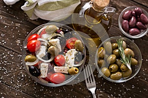 Greek salad with fresh vegetables, feta cheese and green olives