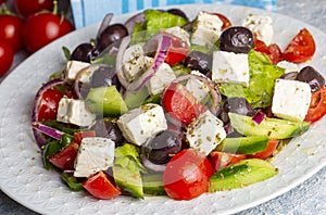 Greek salad with fresh vegetables, feta cheese and kalamata olives. Healthy food