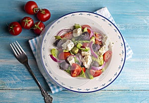 Greek salad with fresh vegetables, feta cheese and kalamata olives. Healthy food