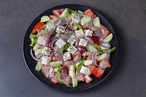 Greek salad with fresh vegetables, feta cheese and kalamata olives. Healthy food