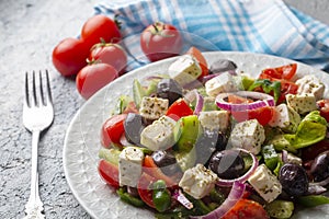 Greek salad with fresh vegetables, feta cheese and kalamata olives. Healthy food