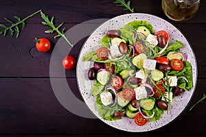 Greek salad with fresh vegetables, feta cheese and kalamata olives.