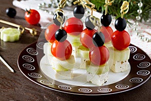 Greek salad with fresh vegetables, feta cheese and olives. Appetizer canape