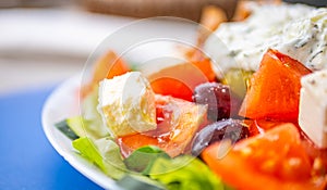 Greek salad with fresh vegetables, feta cheese, tomatoes and olives. Healthy food