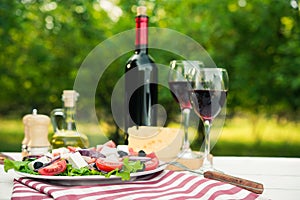 Greek salad and glass of wine