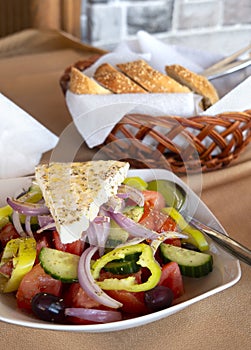 Greek salad Horiatiki with feta cheese and homemade bread in the Meteora mountains in Greece photo