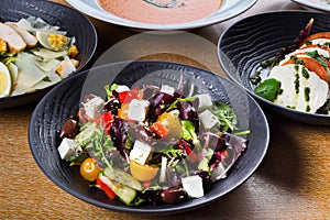 Greek salad or horiatiki salad is a salad in Greek cuisine. Greek salad is made with tomatoes