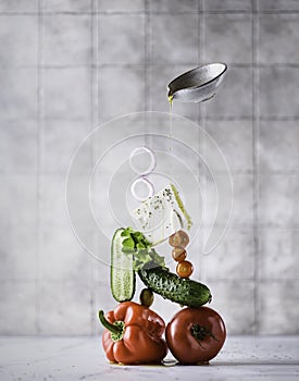 GREEK salad levitation on gray background