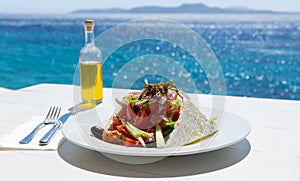 Greek salad and olive oil bottle