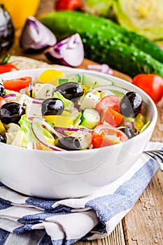 Greek salad of organic tomatoes, cucumber, red onion, olives and feta cheese