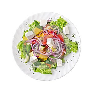 Greek Salad on a plate, isolated on white background. Top view. photo