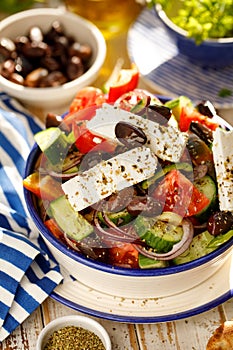 Greek salad. Traditional Greek salad consisting of fresh vegetables such as tomatoes, cucumbers, peppers, onions, oregano and oliv