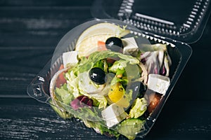 Greek salad with veal in a box photo