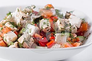 Greek salad. Vegetable with cheese, green salad, with cherry tomatoes, fetta cheese, red onion, and mixed greens