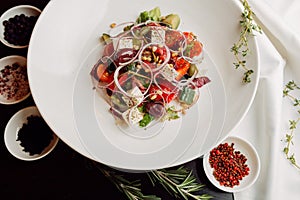 Greek salad on the white plate