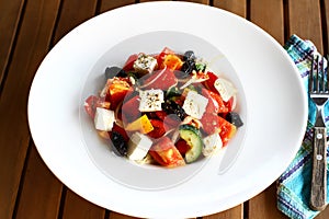 Greek salad on a white plate, horiatiki salata