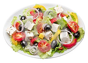 Greek salad on white plate isolated on white background. File contains clipping path photo