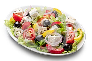 Greek salad on white plate isolated on white background. File contains clipping path