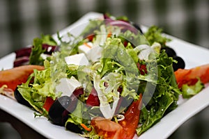 Greek salad on a white plate