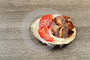 Greek souvlaki with pita bread and vegetables close-up on the table. Pork table