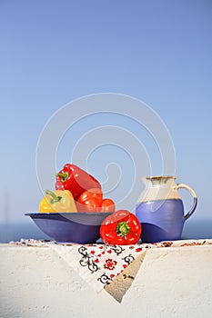 Greek still life with peppers and wine can