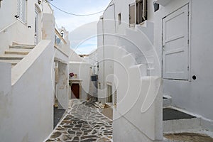 Greek street with whitewashed architecture