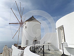 Greek Style White Windmill and Architectures in the afternoon Sunlight, Santorini Island of Greece