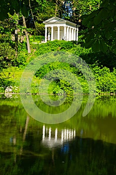 A Greek stylized building in a park