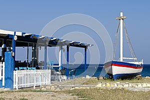 Greek tavern with sea view and boat