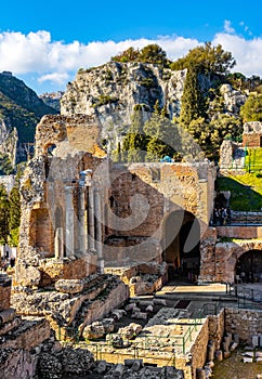 Greek Teatro antico Ancient Theatre with stage and arches colonnade in Taormina at Ioanian sea shore of Sicily in Italy