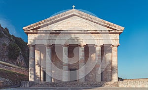 Greek temple in corfu with clear blue sky