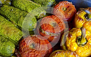 Greek traditional food Gemista. Stuffed peppers, tomatoes, zucchini with rice, vegetables and herbs