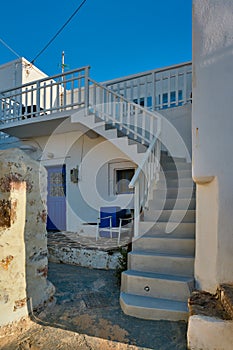 Greek village typical view with whitewashed houses and stairs. Plaka town, Milos island, Greece