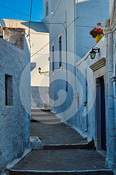 Greek village typical view with whitewashed houses and stairs. Plaka town, Milos island, Greece