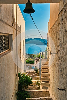 Greek village typical view with whitewashed houses and stairs. Plaka town, Milos island, Greece