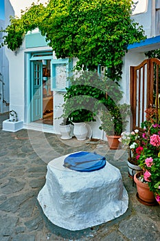 Greek village typical view with whitewashed houses and stairs. Plaka town, Milos island, Greece