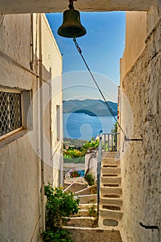 Greek village typical view with whitewashed houses and stairs. Plaka town, Milos island, Greece