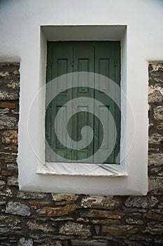 A greek wooden window shutter