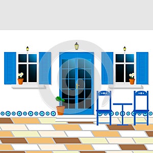 Greek yard with traditional window and the door