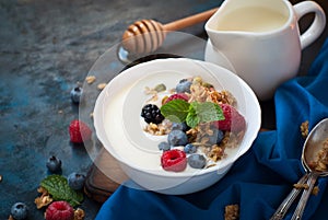 Greek yogurt with granola and fresh berries.