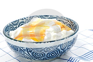 Greek yogurt with honey in a pot