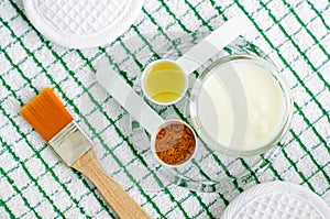 Greek yogurt sour cream or kefir facial mask with turmeric powder and olive oil.