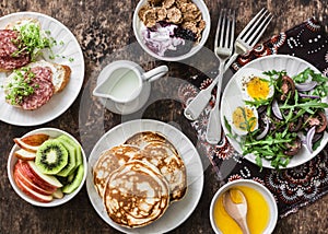 Greek yogurt with whole grain cereals and berry sauce, pancakes, arugula, cherry tomatoes, boiled eggs salad, kiwi, apples fruit,