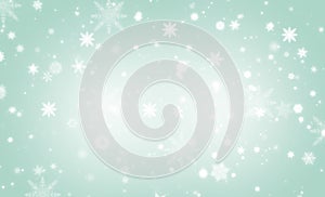 Green  abstract background. white light and snowflakes bokeh winter for Christmas new year blurred beautiful shiny lights