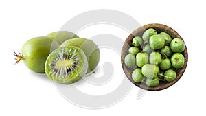 Green actinidia isolated on white background. Actinidia with copy space for text. Kiwi fruit actinidia. Baby kiwi fruits on white