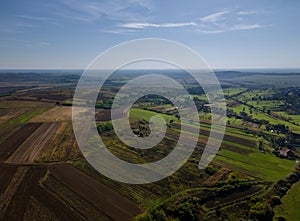 Green of agricultural fields aerial view with roads